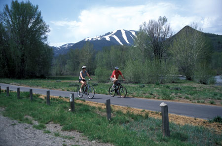 Bike paths lead along the Big Wood River with views of Bald Mountain.